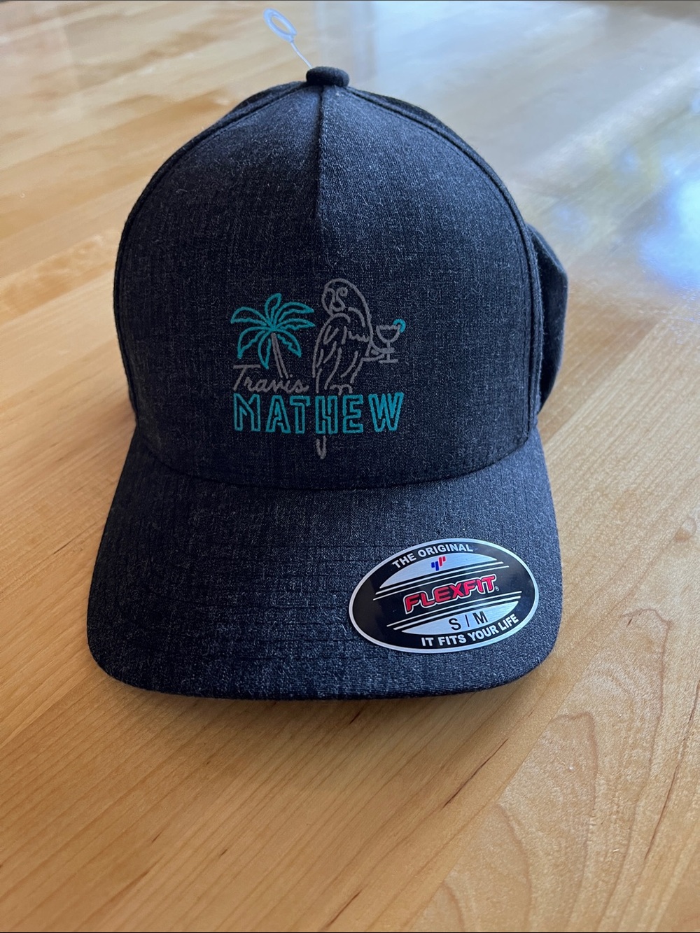 Travis Mathew Charcoal Cap with Teal Embroidery